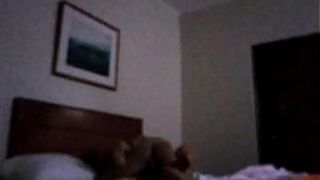 Husband filming beautiful wife with another